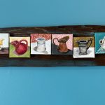Six small still-life panels of cups, jugs and a beet mounted on reclaimed barn wood